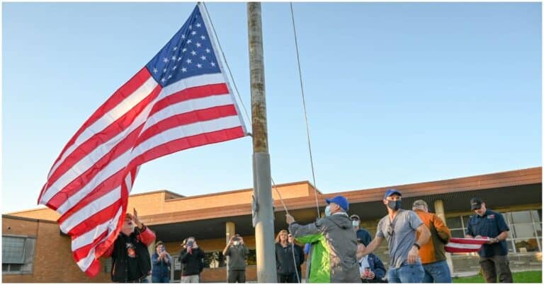 Veterans Raise American Flag Back Up Outside Longfellow Middle School