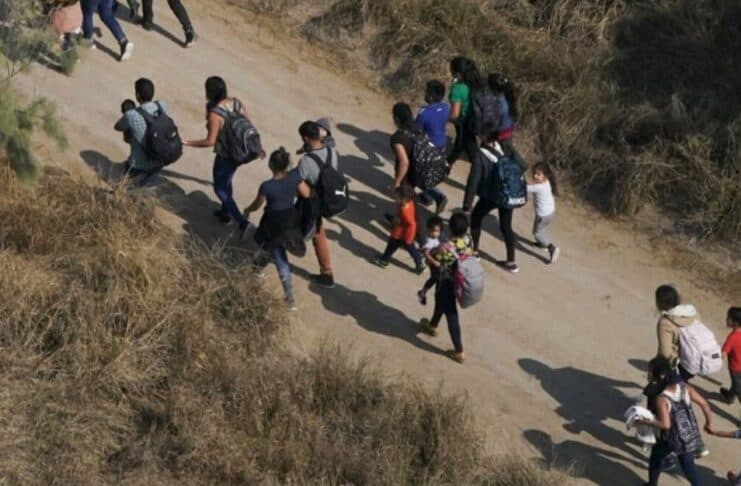 Migrant Students Abbott's Defense of the Border
